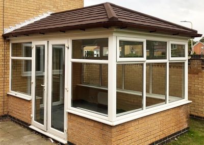 Edwardian Dwarf Wall White Conservatory with Brown Tiled Roof