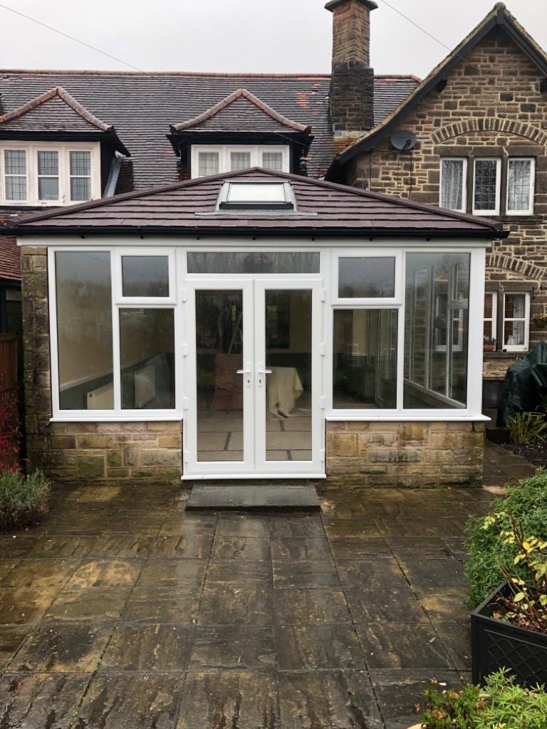 Conservatory with a Brown Roof in Essex