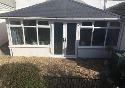 Conservatory with a Grey Tiled Roof