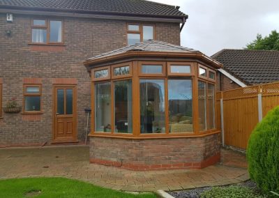 Victorian Conservatory with Brown Frame and Roof