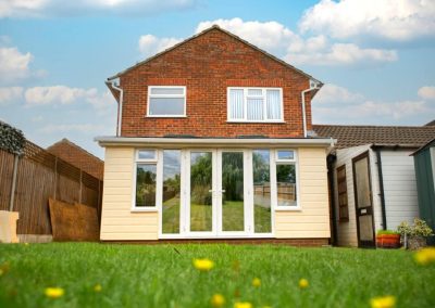 Lean-to Home Extension with Yellow Cladding