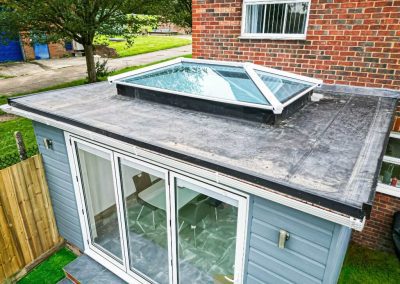 Extension with Blue Cladding and a Flat Roof