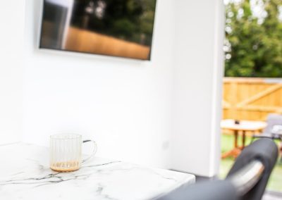 A Glass Coffee Mug on a Marble Dining Room Table